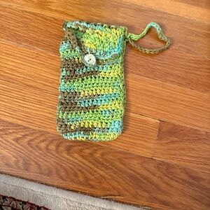 Phone Pouch in Green and Brown length is 6 inches 
Width 4 I use for 16 pro max